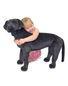 großer schwarzer Labradaor als Plüschtier