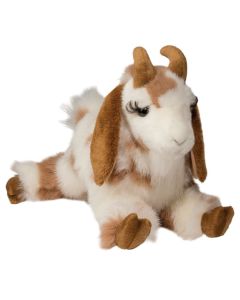 liegende Plüschtier Ziege mit braun-weißer Fellfärung und langen Wimpern.